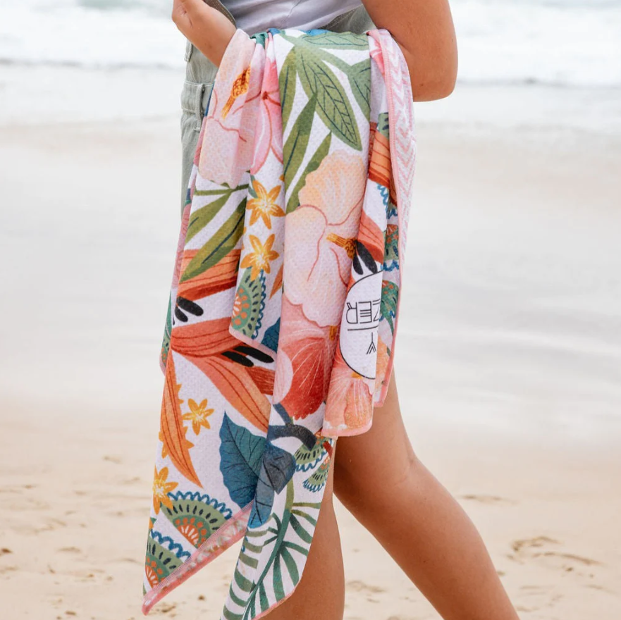 Skygazer Towel - The Avalon. A pink and blue tropical flower design on towel with matching case. Available in-store and online at Eggplant+Poppy, Cairns.