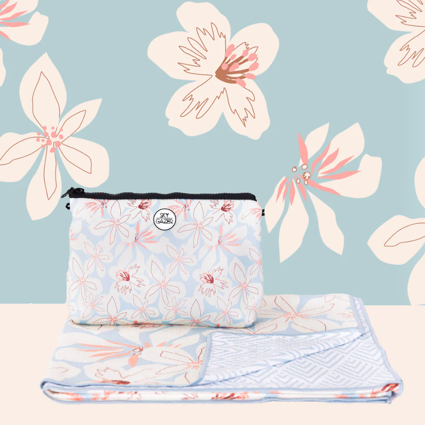 Skygazer Towel - The Altona. A pink, blue and white flower design on towel with matching case. Available in-store and online at Eggplant+Poppy, Cairns.